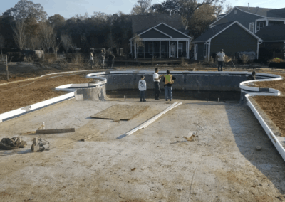 A concrete swimming pool build in a residential neighborhood in South Carolina