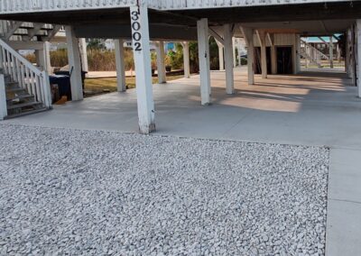 A gravel and concrete driveway and carport renovation and replacement project in North Carolina