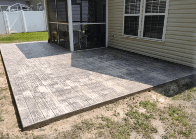 Wood grain textured concrete patio at a home in Longs, South Carolina